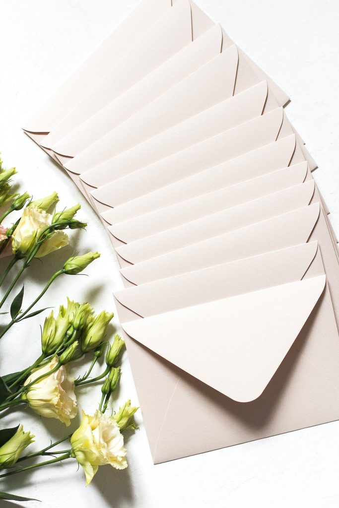 Envelopes with bouquet of delicate flowers